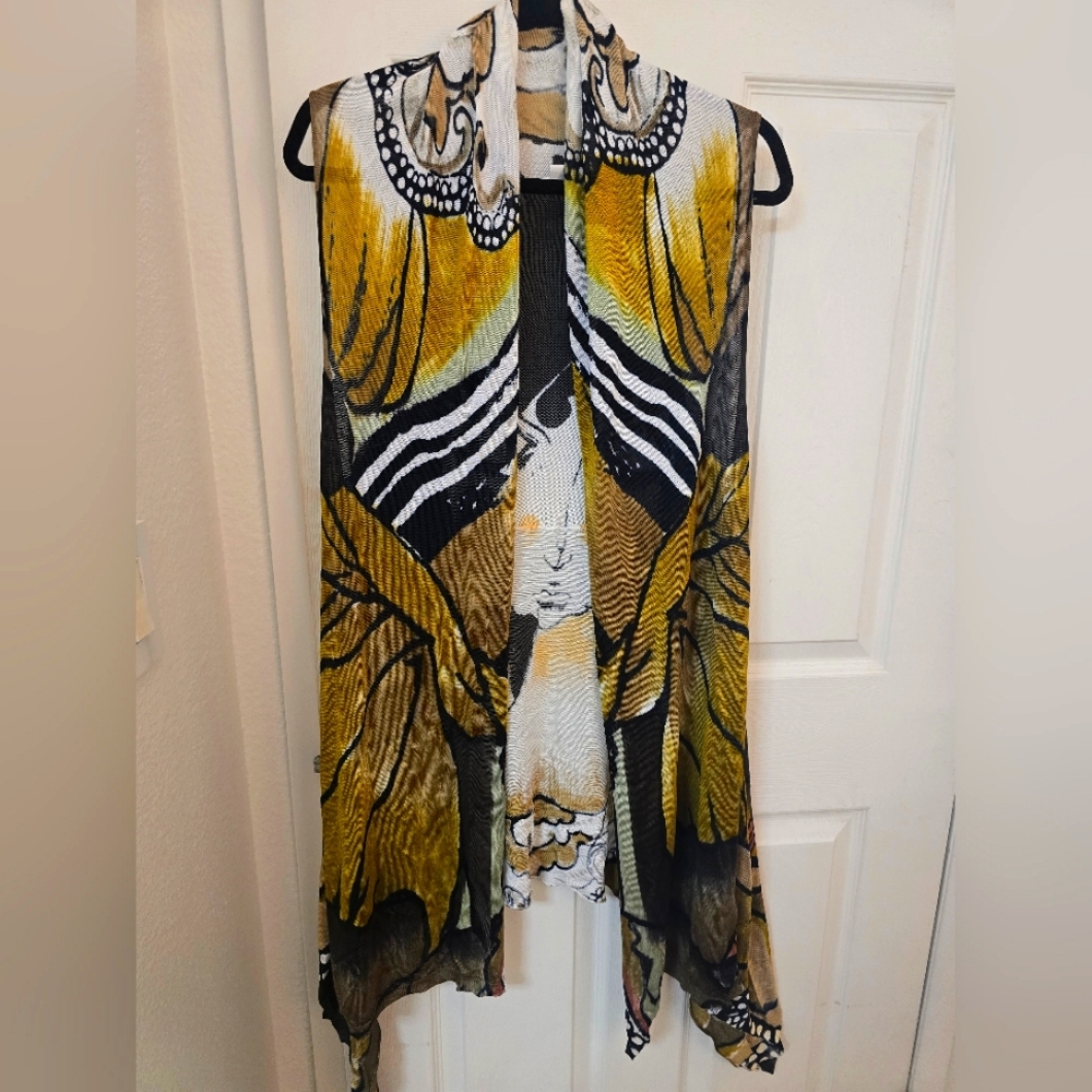 Stylish women's top featuring a vibrant yellow and black design. Perfect for add